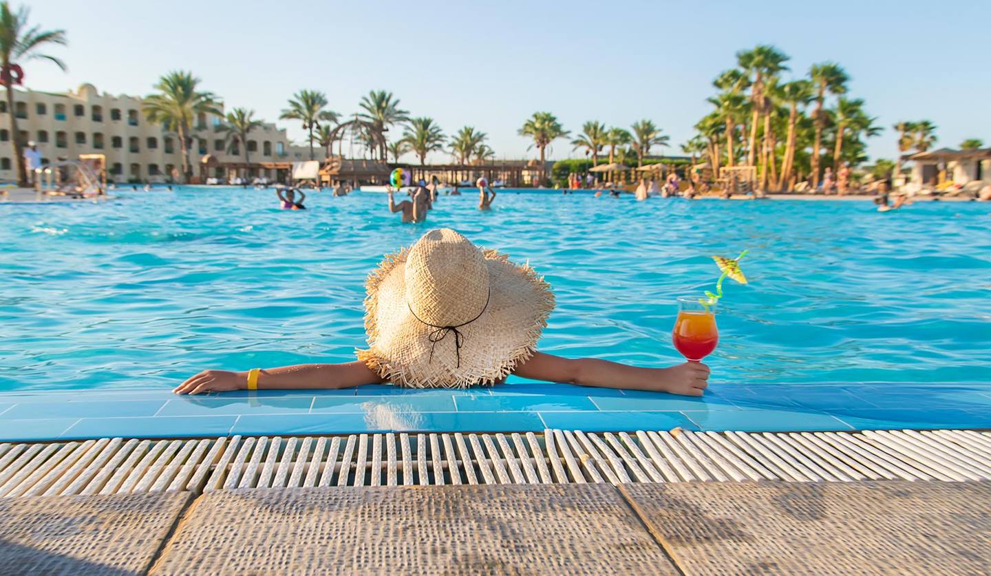 Resort-style stay with a pool and palm trees