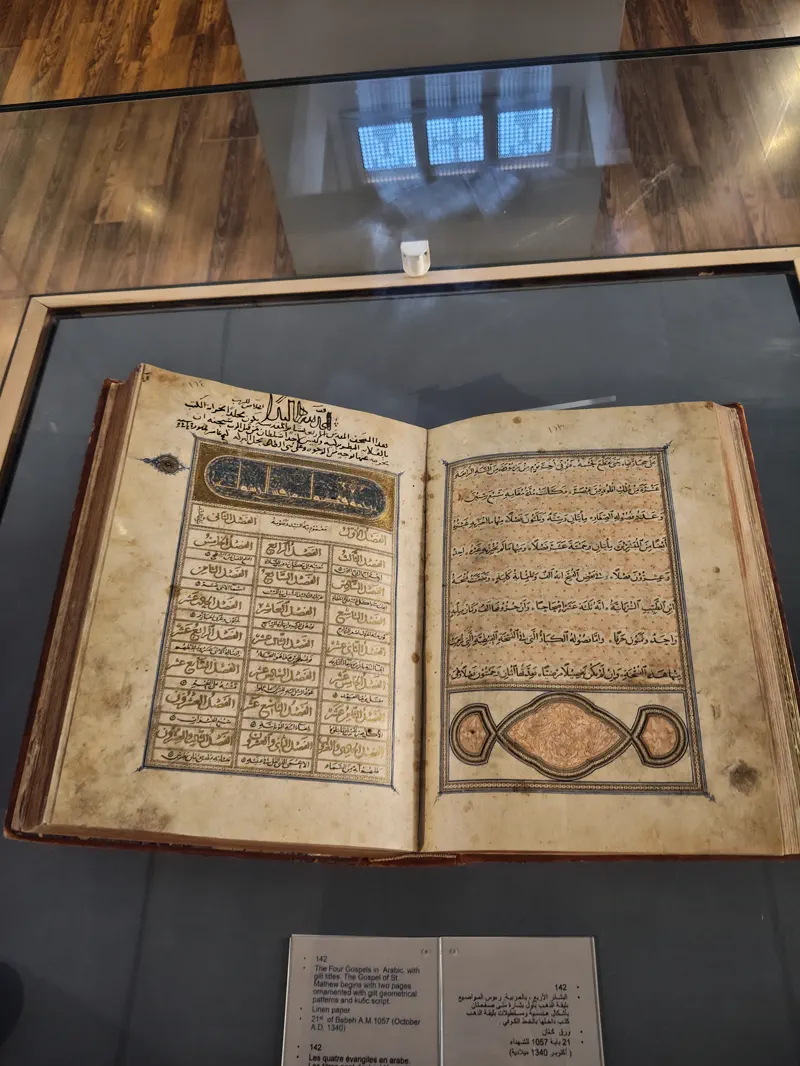 Open manuscript displayed inside the Coptic Museum